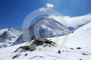 snowy summit of a mountain, as seen from base camp