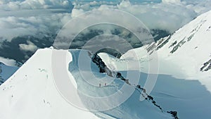 Snowy summit of mountain in european alps. Aerial view