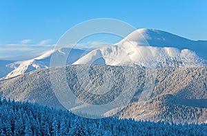 Snowy sunrise mountain landscape