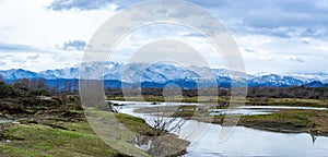 Snowy Talysh mountains, greens and Lankaran river in Azerbaijan