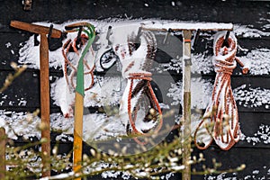 Snowy tools attached to wooden shed,the Netherlands