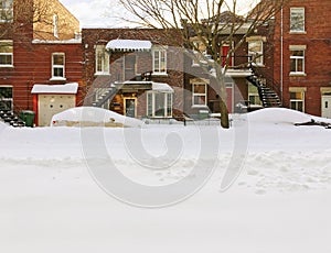 Snowy urban street with brick buildings