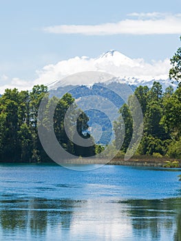 The snowy Villarrica Volcano from the Pullinque lagoon, in the Chilean Patagonia, Los Rios region. Chile