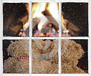 Snowy windowpane with teddy bears by fireplace