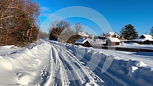 Snowy winter forest countryside . Wooden log houses Russian village covered snow. Winter Russia
