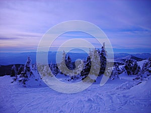 Snowy winter landscape in the mountains at dusk