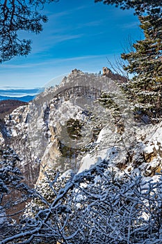 Snowy winter landscape with rocky mountain range