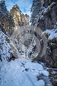 Snowy winter landscape with a tourist trail