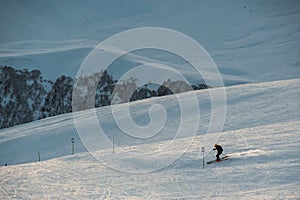 Snowy winter mountains in sun day. Georgia, from ski resort Gudauri.