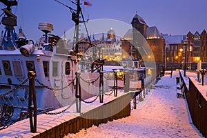 Snowy winter in the old town of Gdansk with frozen Motlawa river, Poland