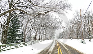 Snowy Winter Road Scene with Yellow Stripe