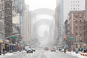 Snowy winter street scene looking down 3rd Avenue in New York City