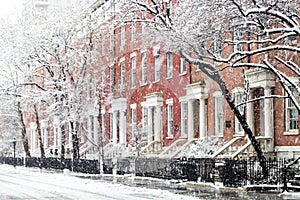 Snowy winter street scene by Washington Square Park in New York City