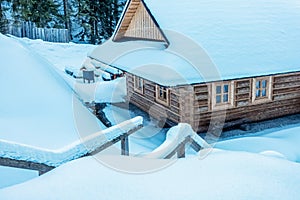 Snowy wooden cottage