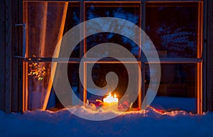 Snowy Wooden Window, Christmas Decoration and Candles