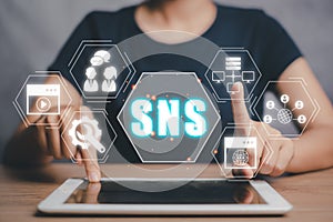 Person hand using tablet computer with Social Networking Service icon on virtual screen