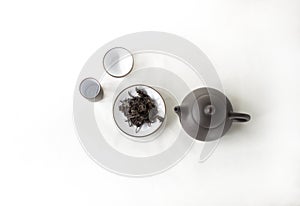 snuff cup with black tea, gaivan and a tea cup on a white backgroun
