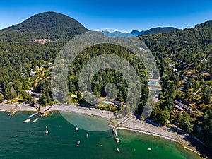 Snug Cove, Bowen Island, British Columbia, Canada. Aerial view of marina, pier, beach and resorts