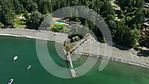 Snug Cove, Bowen Island, British Columbia, Canada. Aerial view of marina, pier, beach and resorts