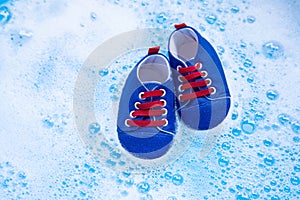 Soak baby shoes in baby laundry detergent water dissolution befo photo