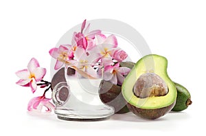 Soak hair with coconut oil and avocado fruits isolated on white background