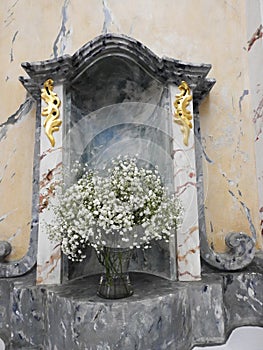 Soak white flowers in church, Lithuania