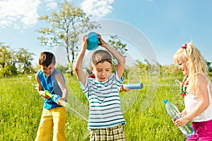 Soaked happy kids photo