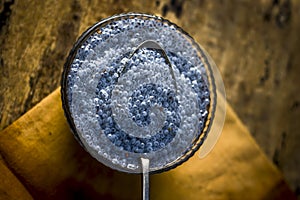 Soaked sweet basil seeds or sabja seeds in a glass bowl on wooden surface.