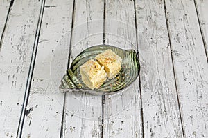 Soan papdi is a popular Indian dessert. It is usually cube-shaped or served