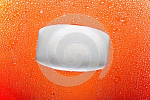 Soap bar on orange abstract background.