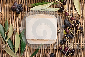 Soap bar on a wattled table with olive branches mockup