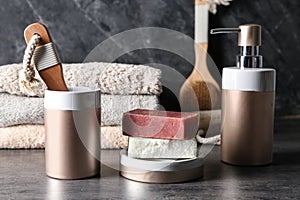 Soap and bathing accessories on table