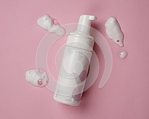 Soap bottles with pump mockup isolated on pink background.