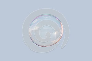 Soap bubble on blue sky isolated