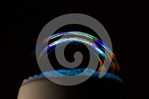 soap bubble close-up on a black background. macro photo isolated bubble