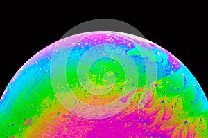Soap bubble close up macro psychedelic abstraction and planet imitation. Abstract background with colorful gradient rainbow colors