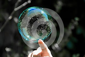 Soap bubble in a green hue