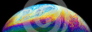 Soap bubble half circle chape psychedelic color on black background macro picture photo