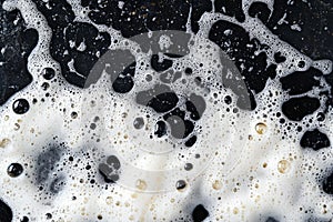 Soap bubbles on black surface with dynamic patterns. Neural network AI generated