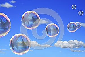 Soap bubbles on blue sky