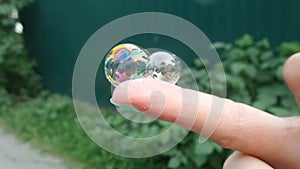 Soap bubbles on the finger