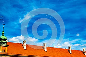 Soap Bubbles fly in the sky. Background bright, blue sky and fluffy white clouds