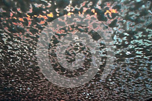 Soap on a car window in a carwash