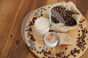 Soap, cream and scrub and coffee beans in burlap sack