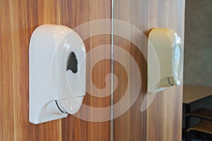 Soap dispenser in toilet.