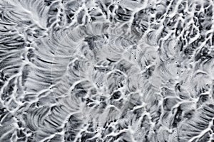 Soap foam on black. Abstract background of cleaning agent.