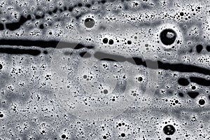 Soap foam on black. Abstract background of cleaning agent.