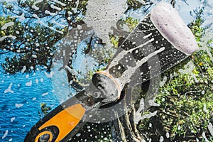 Soap foam on glass- cleaning of contaminated surfaces. Clean background- clipart photo