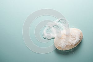 Soap and foam on a light background with place for text