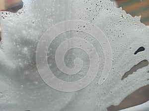 Soap on glass with water after wash